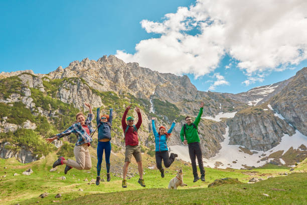 istock hiking friends jumping 972446726