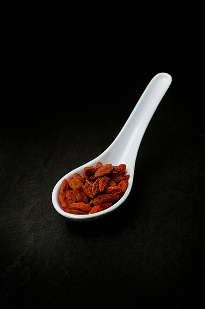 Goji Berries in white spoon stock photo