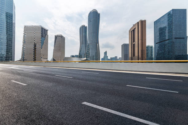 istock Panoramic skyline and modern business office buildings with empty road,empty concrete square floor 972454848