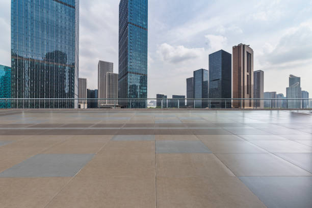 istock Panoramic skyline and modern business office buildings with empty road,empty concrete square floor 972454862