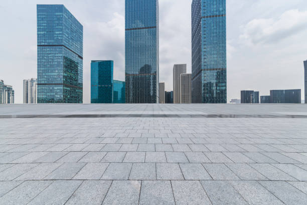 istock Panoramic skyline and modern business office buildings with empty road,empty concrete square floor 972461032
