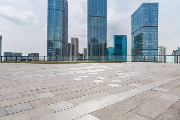 istock Panoramic skyline and modern business office buildings with empty road,empty concrete square floor 972463062