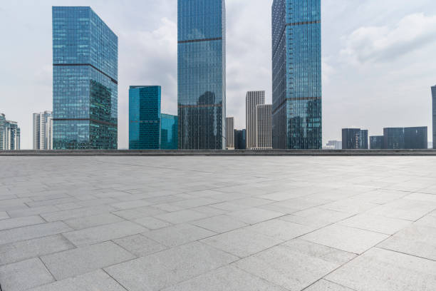 istock Panoramic skyline and modern business office buildings with empty road,empty concrete square floor 972465542