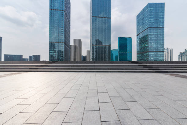 istock Panoramic skyline and modern business office buildings with empty road,empty concrete square floor 972465552
