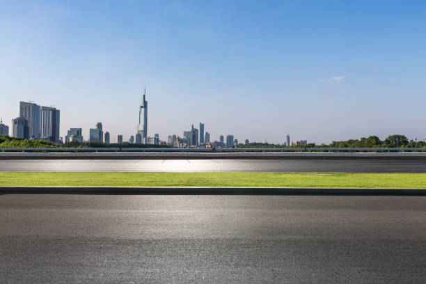 istock Panoramic skyline and modern business office buildings with empty road,empty concrete square floor 972465680