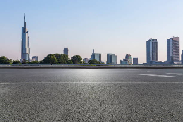 istock Panoramic skyline and modern business office buildings with empty road,empty concrete square floor 972465896