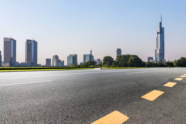 istock Panoramic skyline and modern business office buildings with empty road,empty concrete square floor 972465914