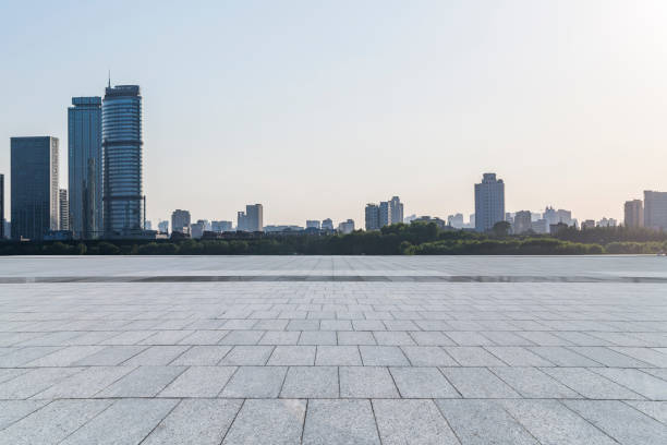 istock Panoramic skyline and modern business office buildings with empty road,empty concrete square floor 972468190