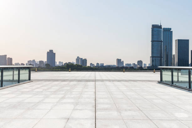 istock Panoramic skyline and modern business office buildings with empty road,empty concrete square floor 972470892