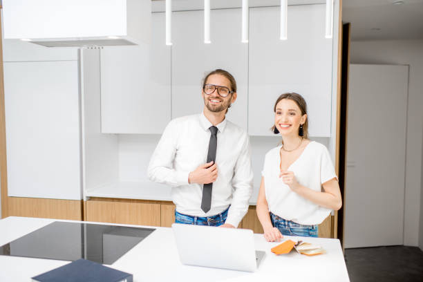istock Couple designing inteiror in the kitchen 972473008