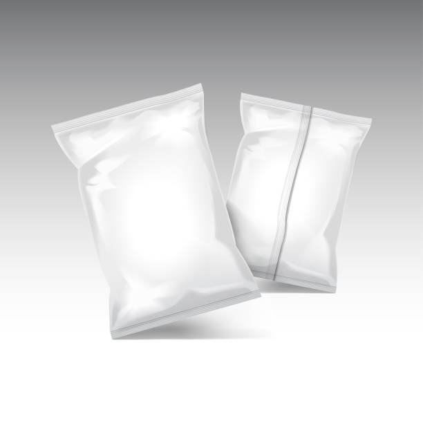 istock Set of vector transparent and white foil bag packaging for food, snack, coffee, cocoa, sweets, crackers, nuts, chips. Plastic pack template 972473216