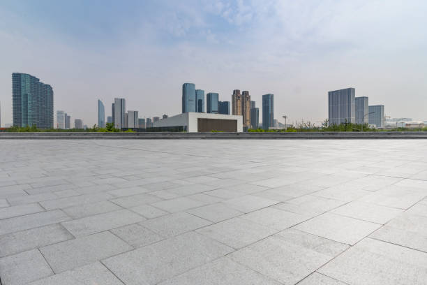 istock Panoramic skyline and modern business office buildings with empty road,empty concrete square floor 972473246