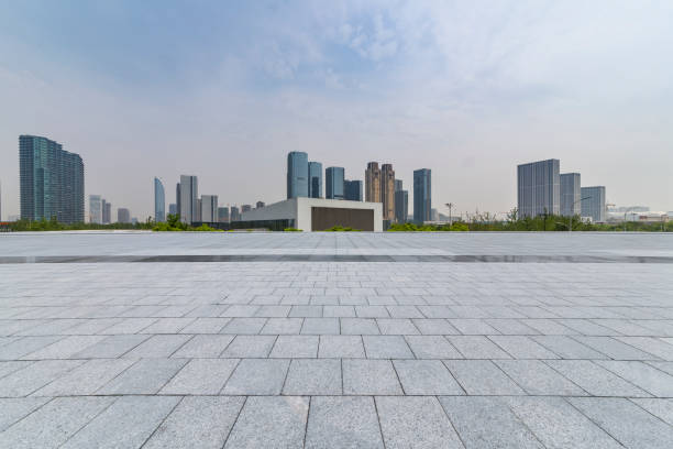 istock Panoramic skyline and modern business office buildings with empty road,empty concrete square floor 972473344