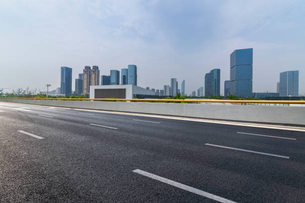 istock Panoramic skyline and modern business office buildings with empty road,empty concrete square floor 972473348