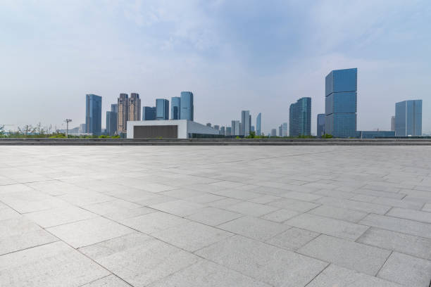 istock Panoramic skyline and modern business office buildings with empty road,empty concrete square floor 972473368