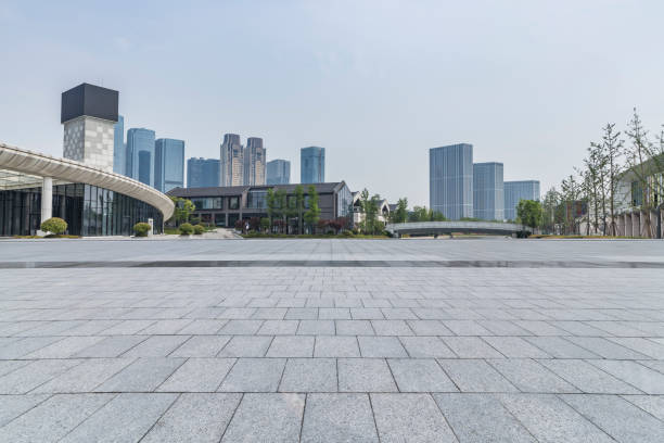 istock Panoramic skyline and modern business office buildings with empty road,empty concrete square floor 972473604