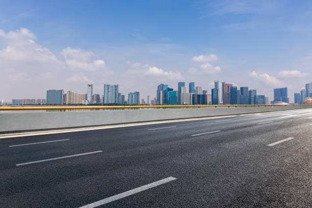 istock Panoramic skyline and modern business office buildings with empty road,empty concrete square floor 972478806