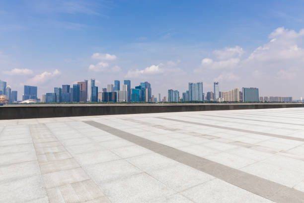istock Panoramic skyline and modern business office buildings with empty road,empty concrete square floor 972478836