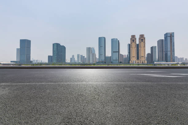 istock Panoramic skyline and modern business office buildings with empty road,empty concrete square floor 972478990