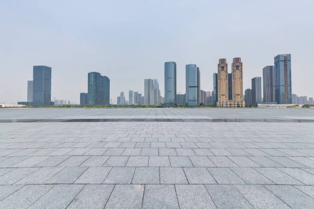 istock Panoramic skyline and modern business office buildings with empty road,empty concrete square floor 972479040