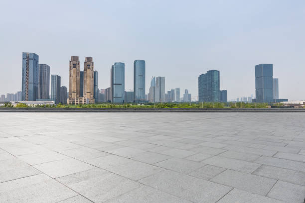 istock Panoramic skyline and modern business office buildings with empty road,empty concrete square floor 972481206