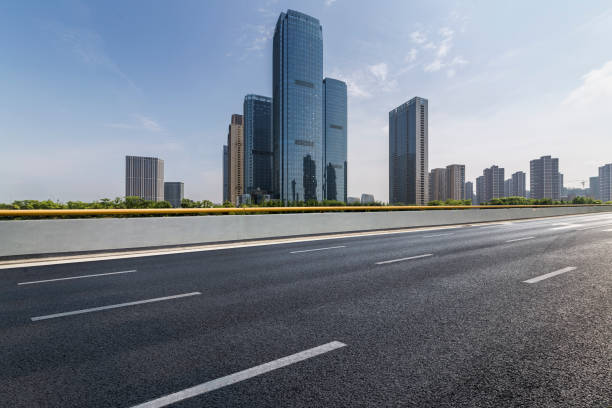 istock Panoramic skyline and modern business office buildings with empty road,empty concrete square floor 972481274