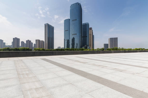 istock Panoramic skyline and modern business office buildings with empty road,empty concrete square floor 972481376