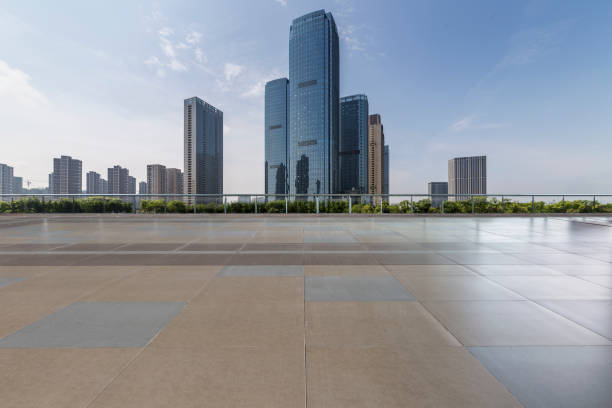 istock Panoramic skyline and modern business office buildings with empty road,empty concrete square floor 972481450