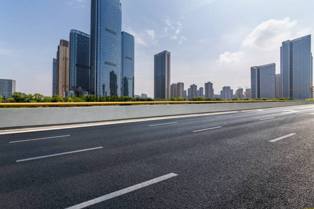 istock Panoramic skyline and modern business office buildings with empty road,empty concrete square floor 972481498