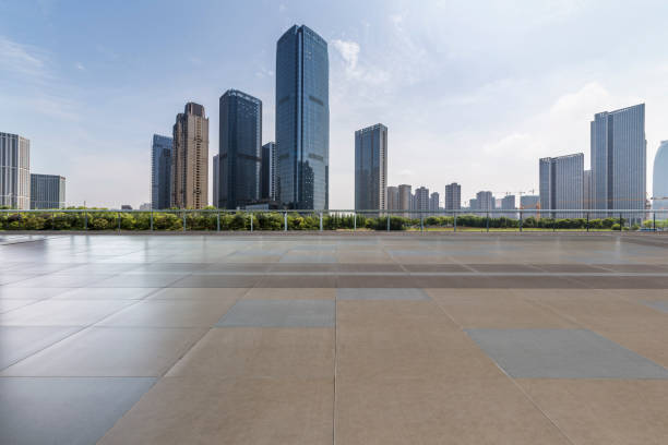 istock Panoramic skyline and modern business office buildings with empty road,empty concrete square floor 972481800