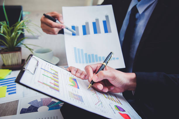 istock Businesspeople partners discussing documents and ideas at discussing together in conference room during meeting at office . 972497540