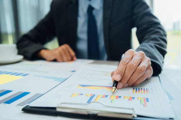 istock Businesspeople partners discussing documents and ideas at discussing together in conference room during meeting at office . 972497712