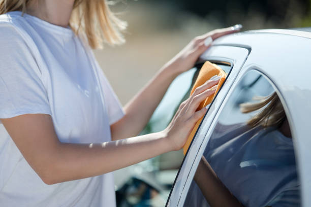 istock Woman clean car 972500454