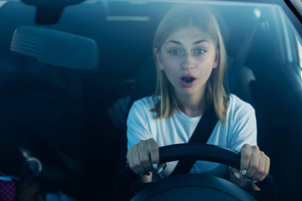 Lexie Roth sitting on the seat of a car