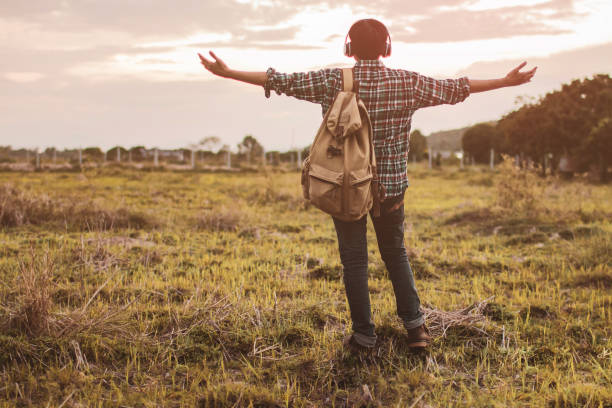 istock Teens are listening to music at close range with a light sunset background. 972509478