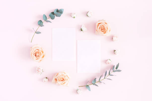 istock Paper blank, rose flowers, eucalyptus branches on pastel pink background 972520444