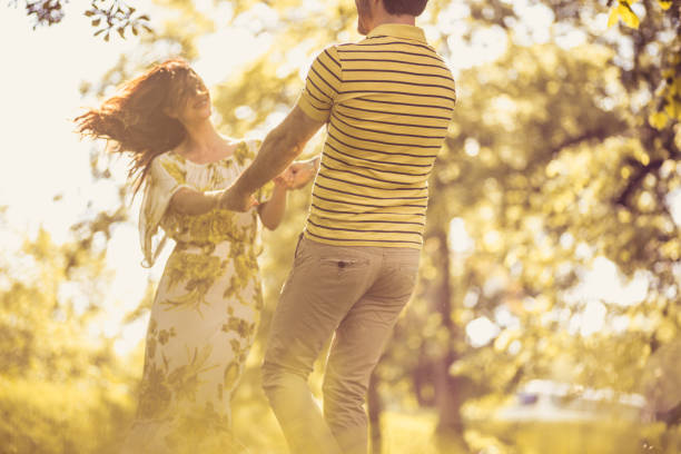 istock Happiness in nature. Middle age couple. 972523610