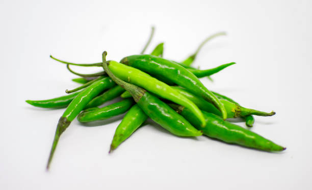 istock Green Chillies on top of other 972532190