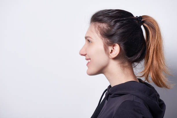 istock Side view of smiling woman looking forward 972544758