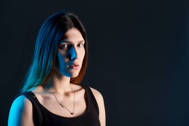istock Closeup woman with blue backlit 972547766