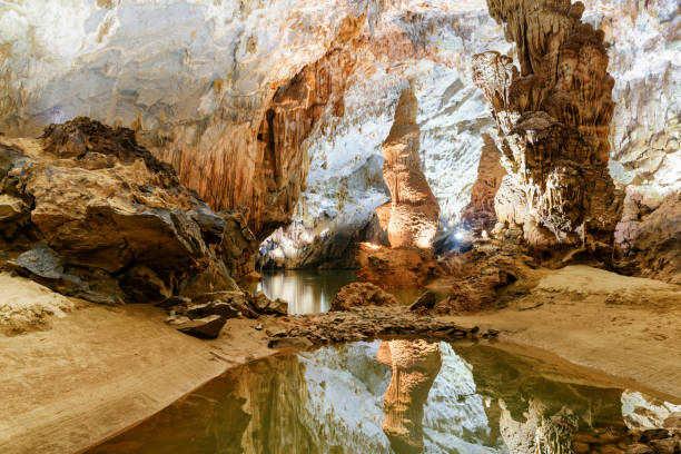 istock Beautiful stalagmite reflected in water inside Phong Nha Cave 972556680
