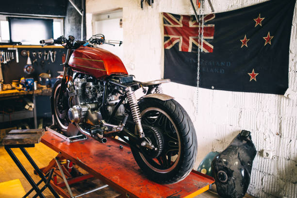 Custom motorcycle shop interior with New Zealand flag on the wall