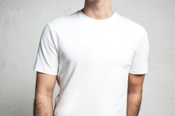 istock Young guy wearing blank white t-shirt, horizontal studio close-up 972560092