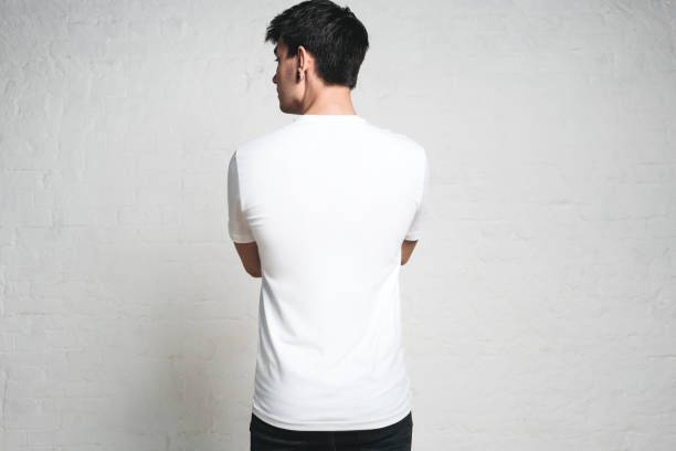 istock Young athletic man wearing blank white t-shirt, back side, horizontal studio portrait 972560204