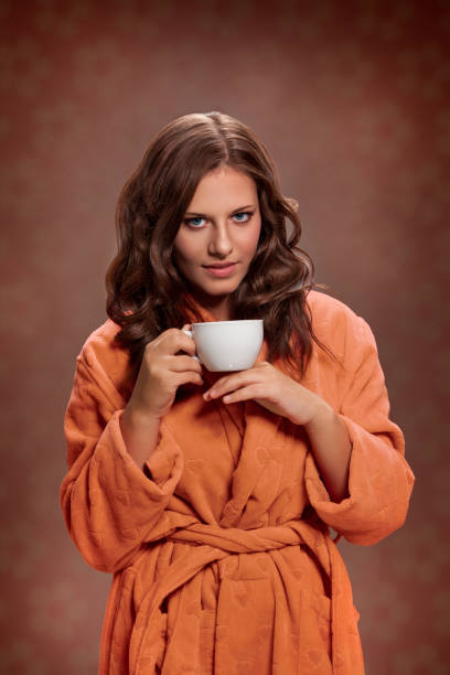 istock Woman holding cup with tea 972562902