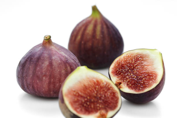 istock Fresh figs fruits isolated on white background 972563360