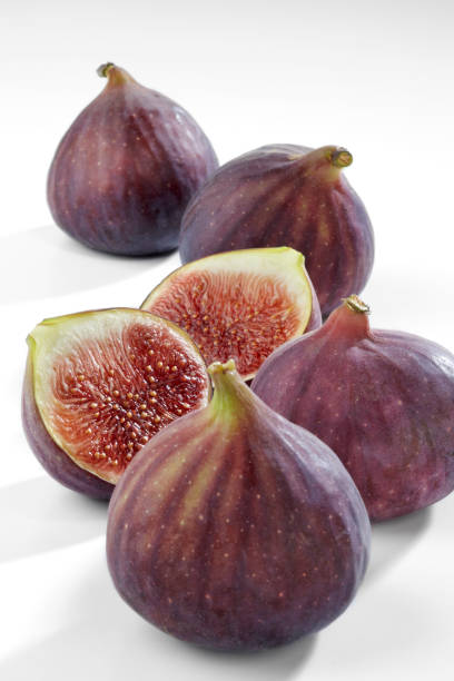 istock Fresh figs fruits isolated on white background 972563560