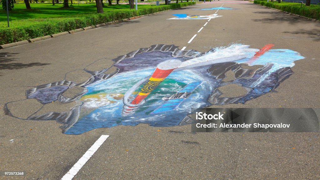 3D street anamorphic painting on asphalt in a park.  Asphalt art concept. Maldives, Hulhumale town. Anamorphic Stock Photo