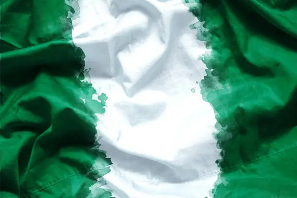 Photo of Flag Federal Republic of Nigeria by watercolor paint brush on canvas fabric, grunge style