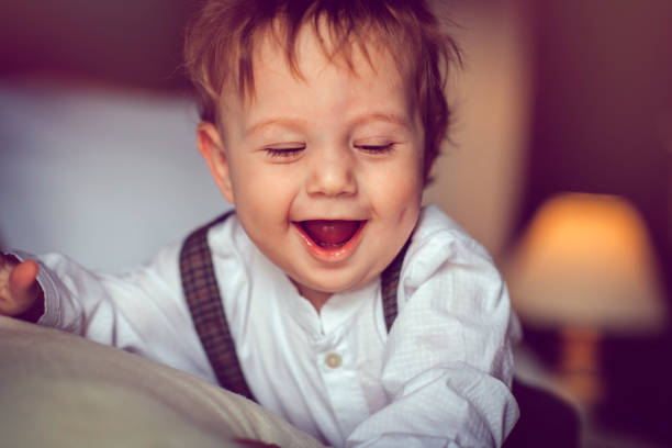 Little boy with swollen eye laughs